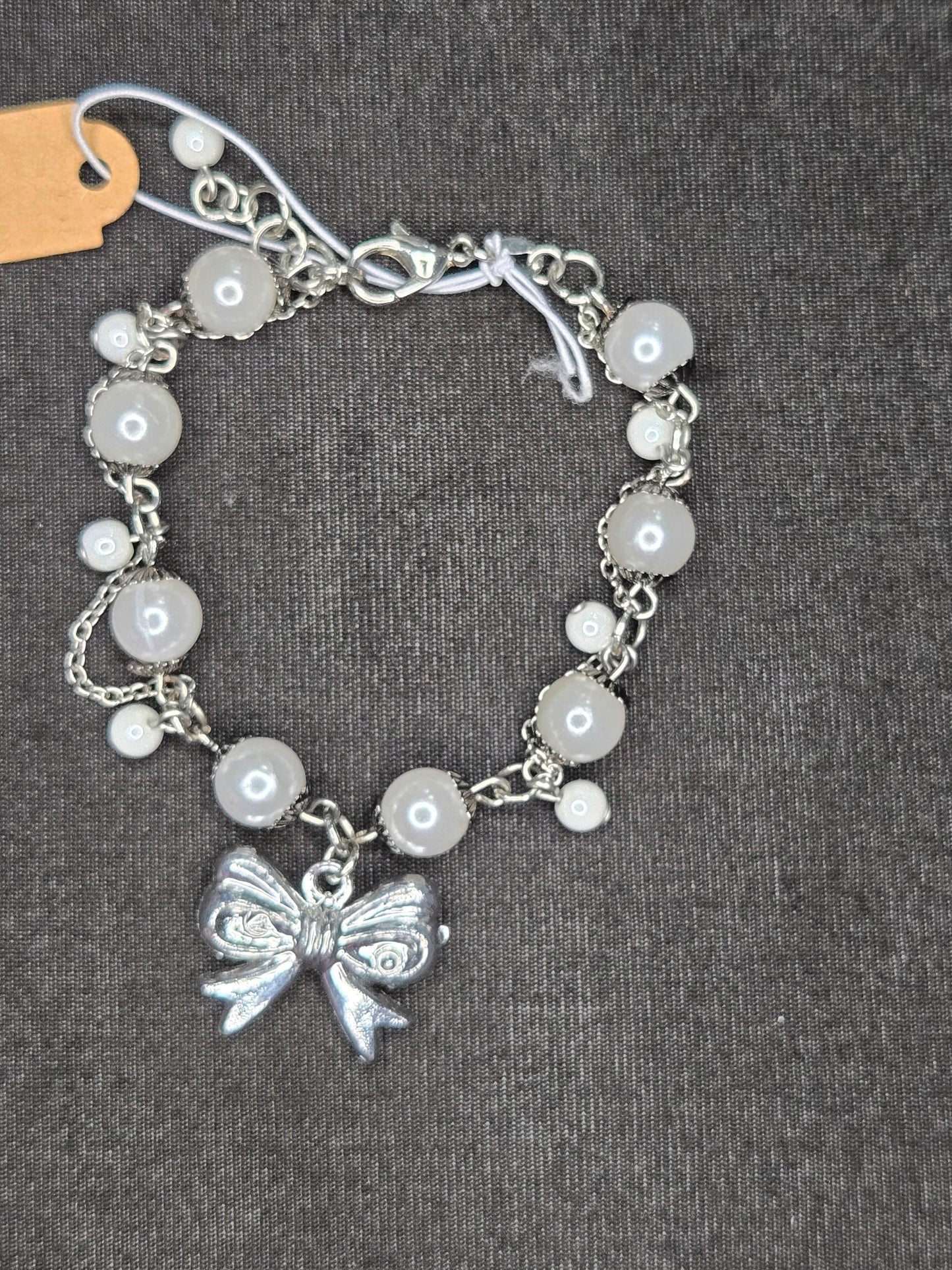 Silver Serenade Bow & Pearl Bracelet – Vintage Charm Chain Design