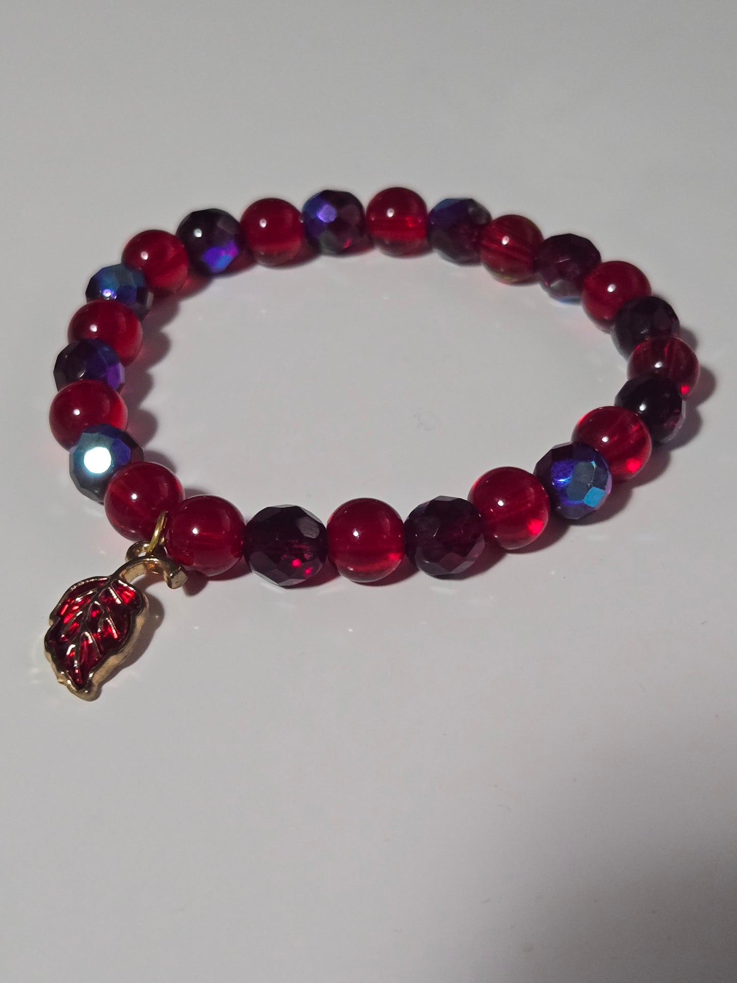 Crimson Bloom Bracelet – Ruby Glass Beads & Golden Leaf Charm